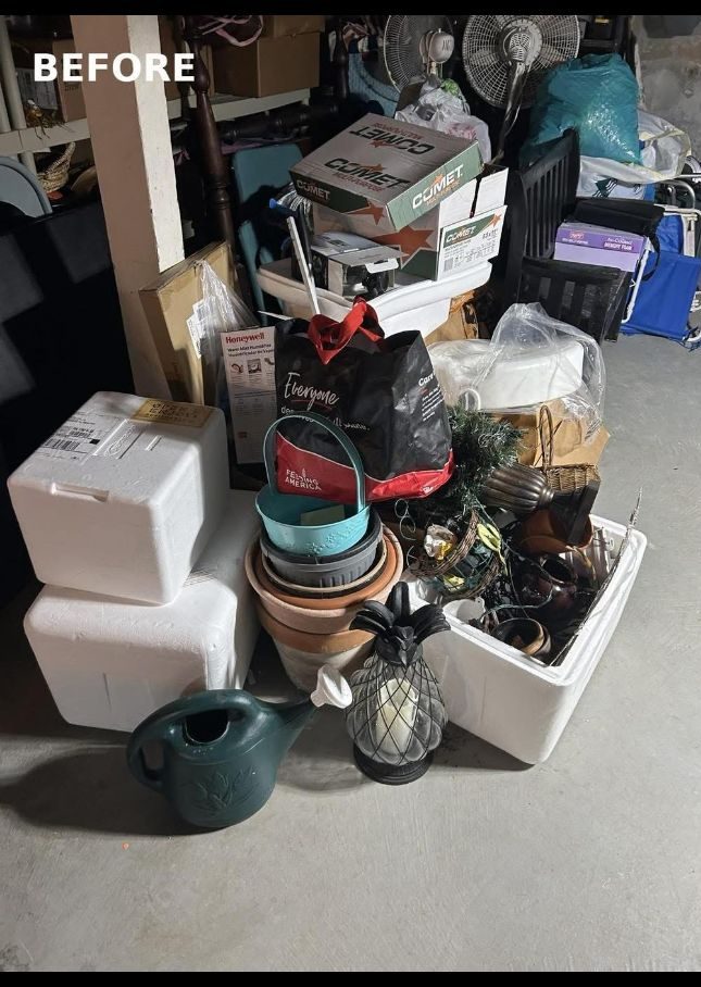 Basement packed with boxes, bins and clutter before the cleanout in Perkasie