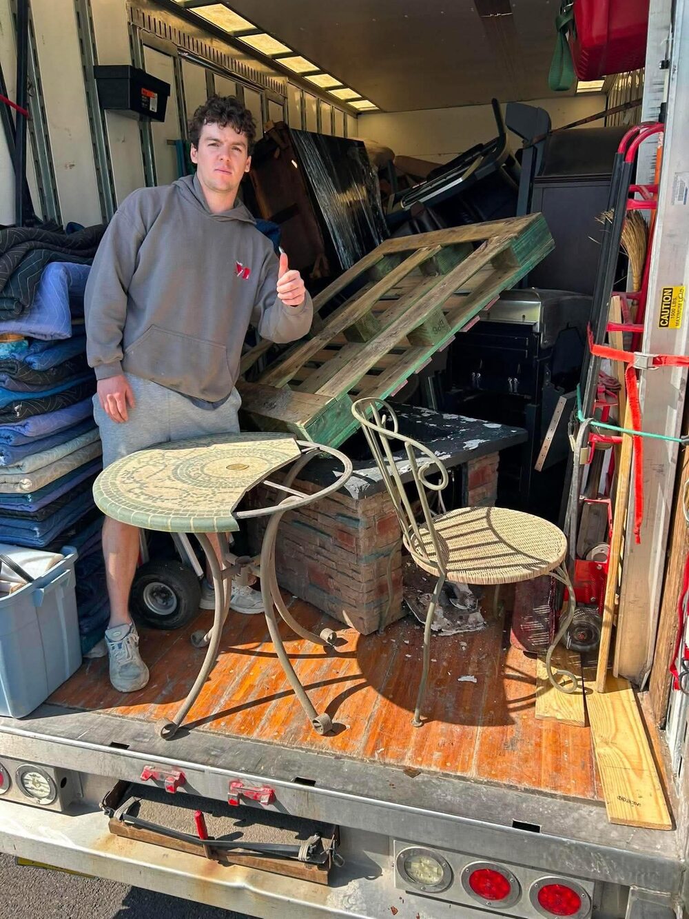 Moodys owner loading furniture onto the truck on a local Bucks County job